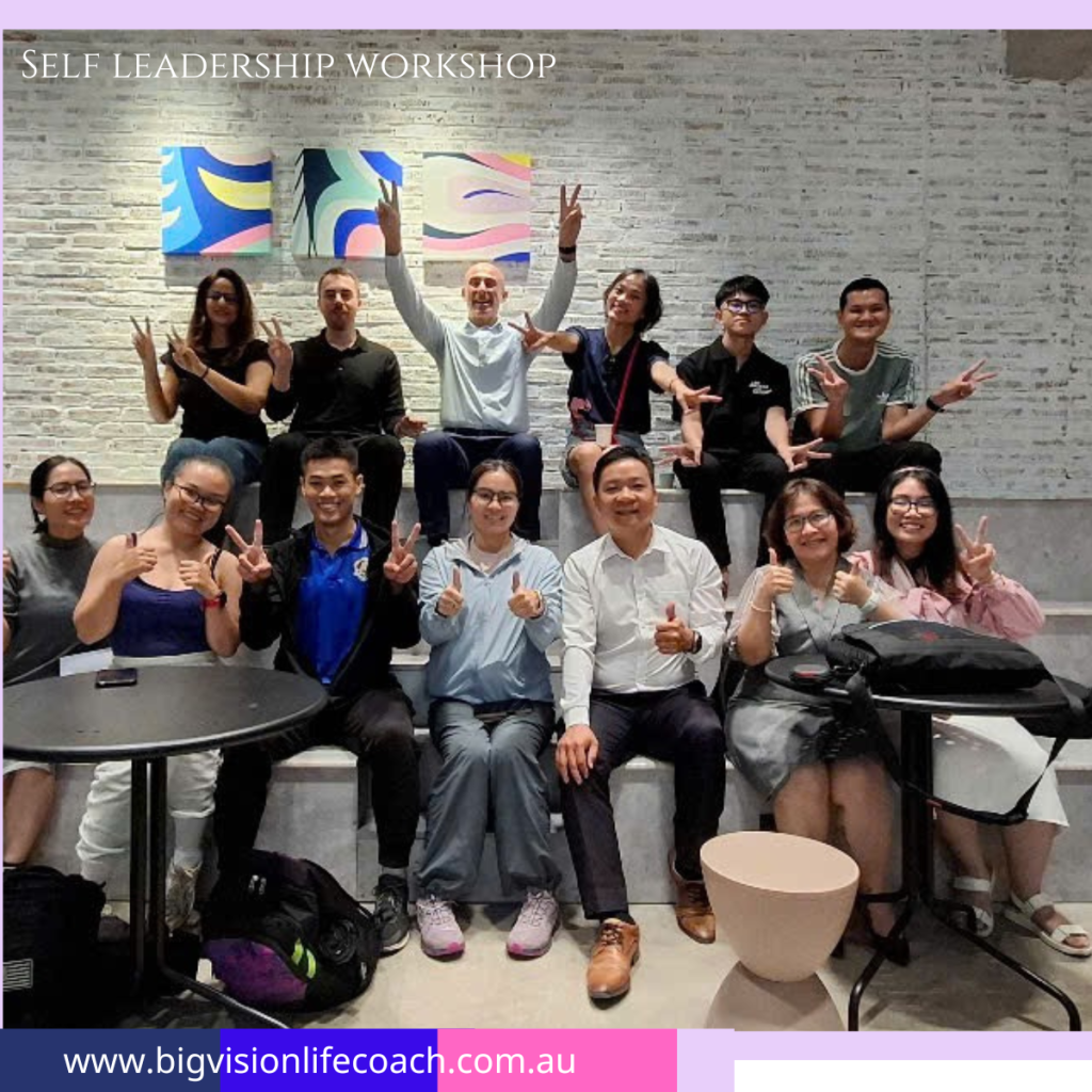 Group photo of self-leadership workshop participants smiling after completion